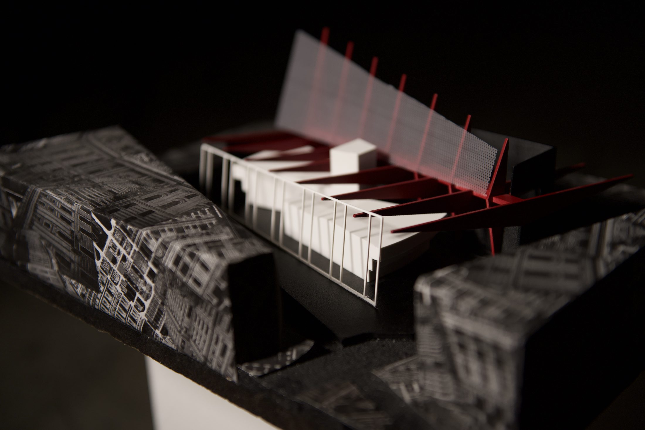 Site model side view roof panel open red structural elements exposed