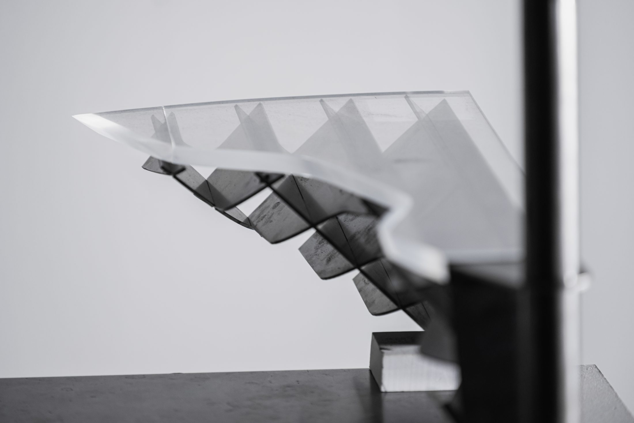 Close-up of acrylic tread and steel panel curvature
