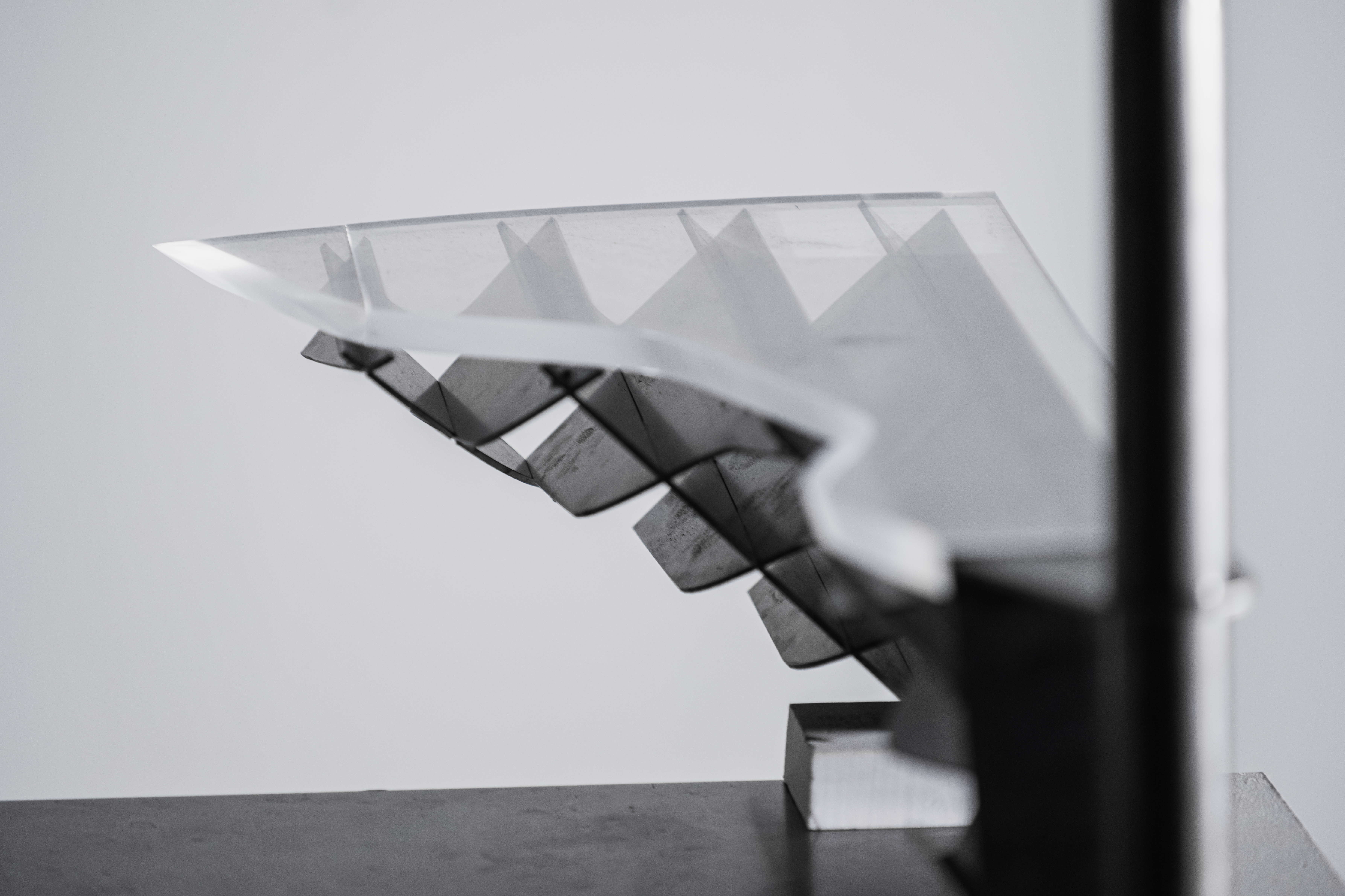 Close-up of acrylic tread and steel panel curvature